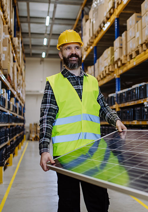 Tepot case study image of worker carrying solar panels